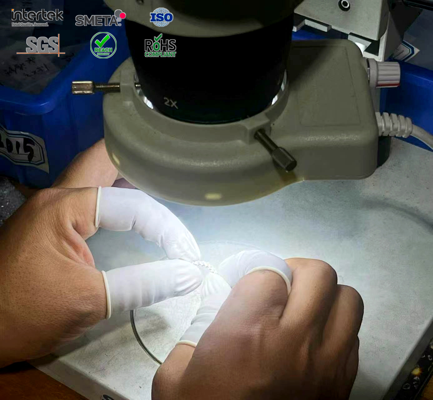 CJFU craftsperson setting stones under a microscope